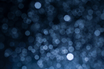 Dark blue abstract background with bokeh. Colorful twinkling lights bokeh light background.