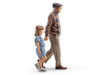 Full length profile shot of a grandfather and granddaughter walking and holding hands