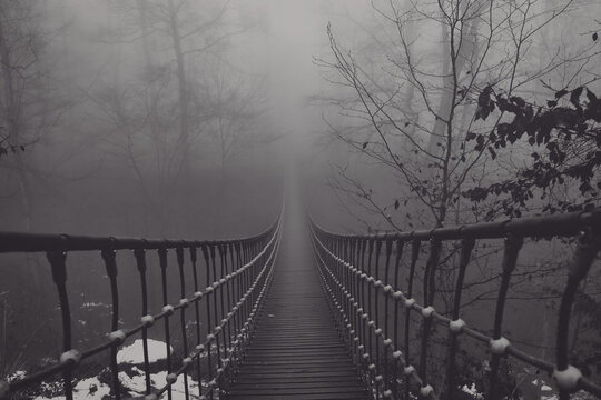 Fototapeta View of a suspension bridge in the fog