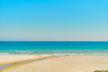 Empty sandy beach and turquoise waters of Mediterranean Sea. Spain