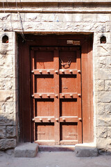 Old Vintage wooden door on retro wall, Pandharpur, India.