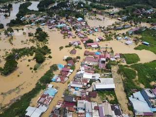 Foto op Aluminium Aerial view of Situation Flood in sangatta city, east kutai, east Kalimantan, Indonesia in 21 March 2022. Floods hit homes and highways, disrupting transportation,  floods because high rainfall. © sukarman