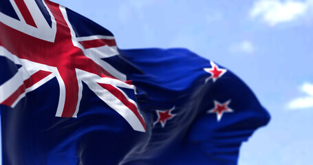 Detail of the national flag of New Zealand waving in the wind on a clear day