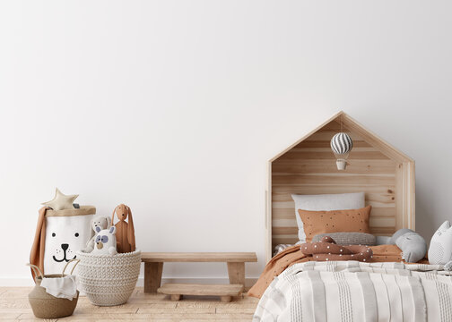 Empty white wall in modern child room. Mock up interior in scandinavian style. Free, copy space for your picture, poster. Bed, rattan basket, toys. Cozy room for kids. 3D rendering.