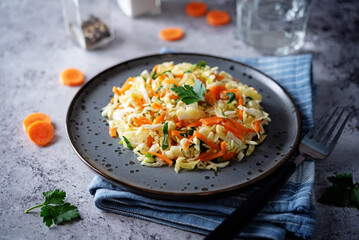 Fototapeta na wymiar Cabbage carrot salad in a bowl