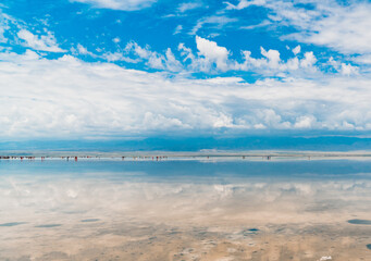 Reflections of the clouds in the clear water of the sea