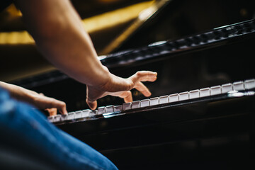 Shallow focus shot of female hands playing piano