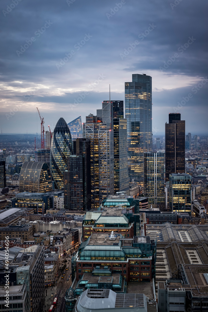 Wall mural Elevated view of the illuminated office skyscrapers at the City of London during dusk, United Kingdom