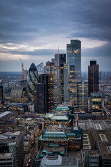 Elevated view of the illuminated office skyscrapers at the City of London during dusk, United...
