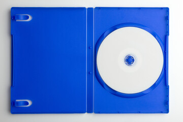 compact disc with a blank surface in open blue dvd box