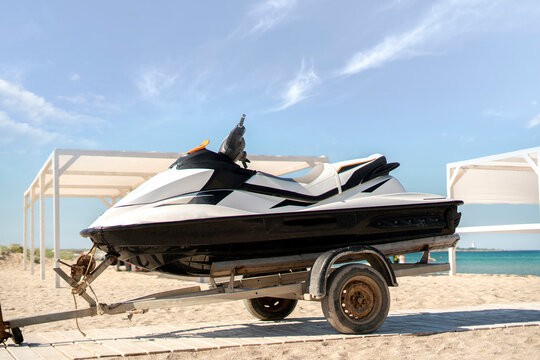 jetski sport water bike on the trailer on the sandy beach summer on vacation