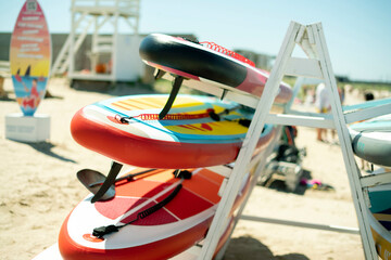 sup surf board rack shelf on the sea coastline vacation concept