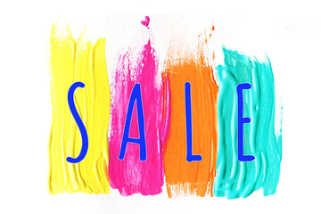the inscription SALE on bright multi-colored strokes of paint..