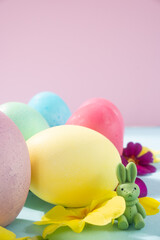 Easter colored eggs on a bright background