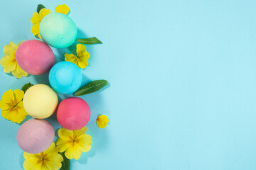Easter colored eggs on a bright background
