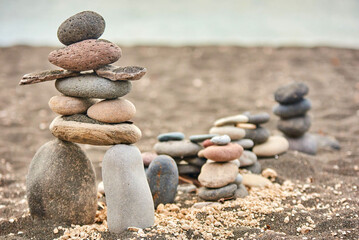 Closeup shot of small pebbles stacked in balance at the beach
