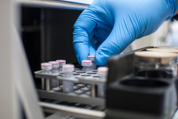 Scientist working in a laboratory with gloves