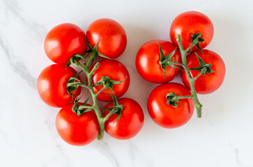 Red tomatoes on white background