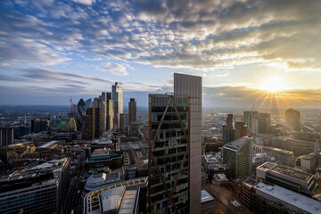 Fototapeta premium The modern skyline with the skyscrapers at the City of London during golden sunset time, England