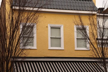 Fototapeta na wymiar Yellow Stucco Building