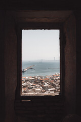 Beautiful shot of Casbah the citadel of Algiers as it's seeing from an old brick window, Algeria
