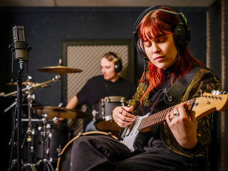 Young woman and man in a recording studio