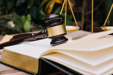 justice and law concept.Male judge in a courtroom on wooden table and Counselor or Male lawyer...