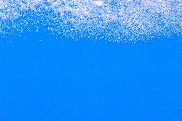 Obraz premium Snow and blue table background.