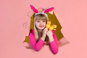 Obraz na płótnie Canvas Cute little girl on Easter holiday with a rabbit costume