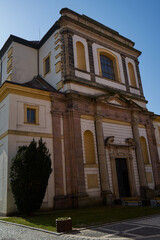 Fototapeta na wymiar Jicin, Czech Republic - March 20, 2022 - The Church of St. James the Greater. It is directly connected by a baroque corridor with the adjacent Waldstein castle.