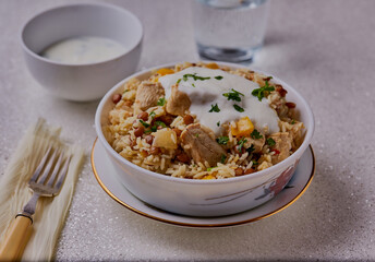 Chicken,lentils and ginger pilaf, garnished with yogurt.