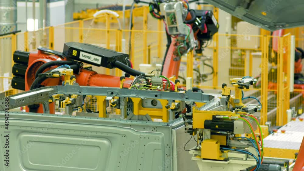Poster automated car assembly at factory. scene. automated machines assemble metal structure at enterprise.
