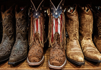 Closeup of Cowboy boots on sale in shops in downtown Nashville, Tennessee - obrazy, fototapety, plakaty