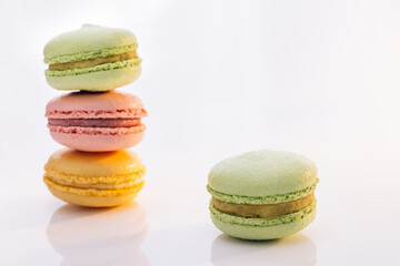 Sweet colorful macarons isolated on white background. Tasty colourful macaroons. Macarons against a bright white background