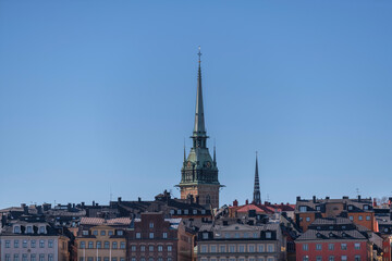Roof and church towers of the old town Gamla Stan a sunny spring day in Stockholm