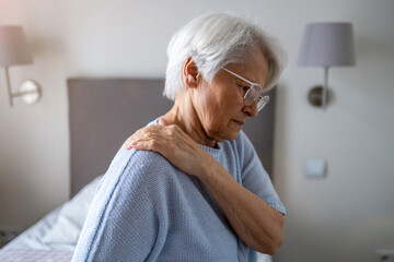 Senior woman suffering from back pain
