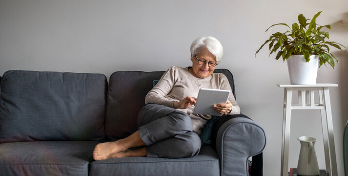 Senior Woman Using A Digital Tablet At Home
