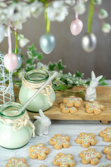 Easter flower biscuits and milk with Easter holiday decoration.