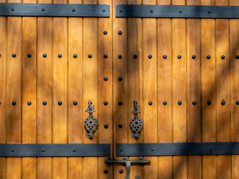 old wooden gates with metal fittings.