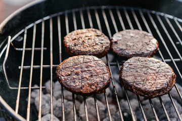 Raw vegan cutlets cooked on the grill outdoors. Plant Based Meat Replacement