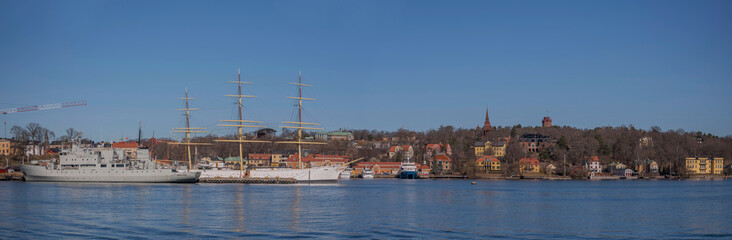 Panorama view of wharf with various boats at the island Djurgården a sunny spring day in Stockholm