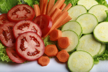 chopped vegetables with tomato, carrot, lettuce and zucchini