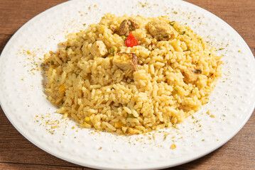 Vegan food, vegan risotto on a white plate, over wood, selective focus.