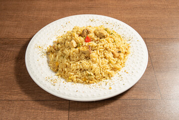 Vegan food, vegan risotto on a white plate, over wood, selective focus.