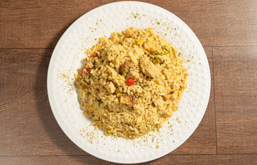 Vegan food, vegan risotto on a white plate, over wood, selective focus.