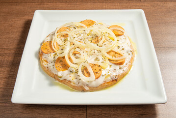Vegan food, vegan pizza on a white plate, over wood, selective focus.