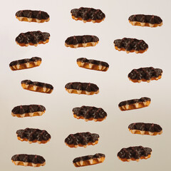 Obraz premium Minimal composition of nutritional chocolate coated Belgian waffles falling into stack on minimal beige background.