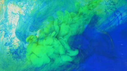 Liquid abstractions, the dissolution of blue, yellow and green paint in water. - Powered by Adobe