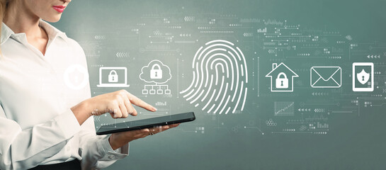 Fingerprint scanning theme with business woman using a tablet computer