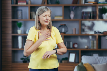 Older woman at home doing fitness has severe shortness of breath and chest pain, compares bullets...